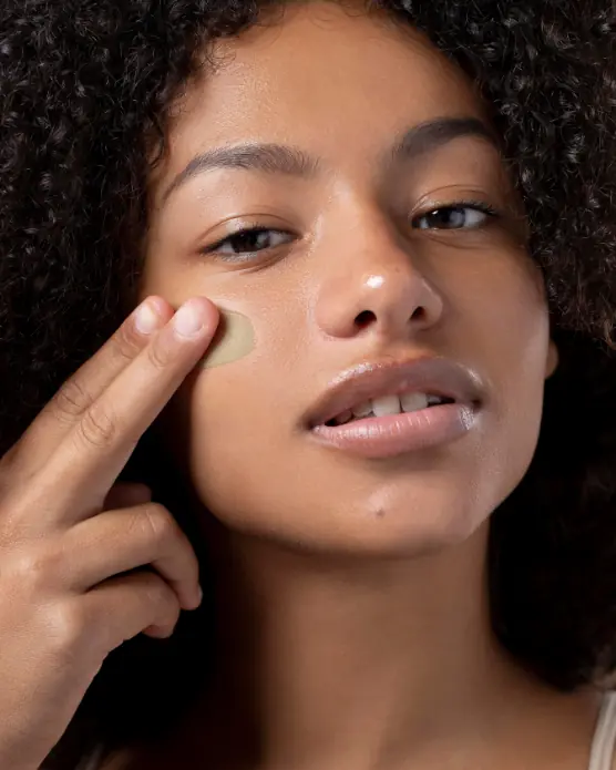 black woman applying cream